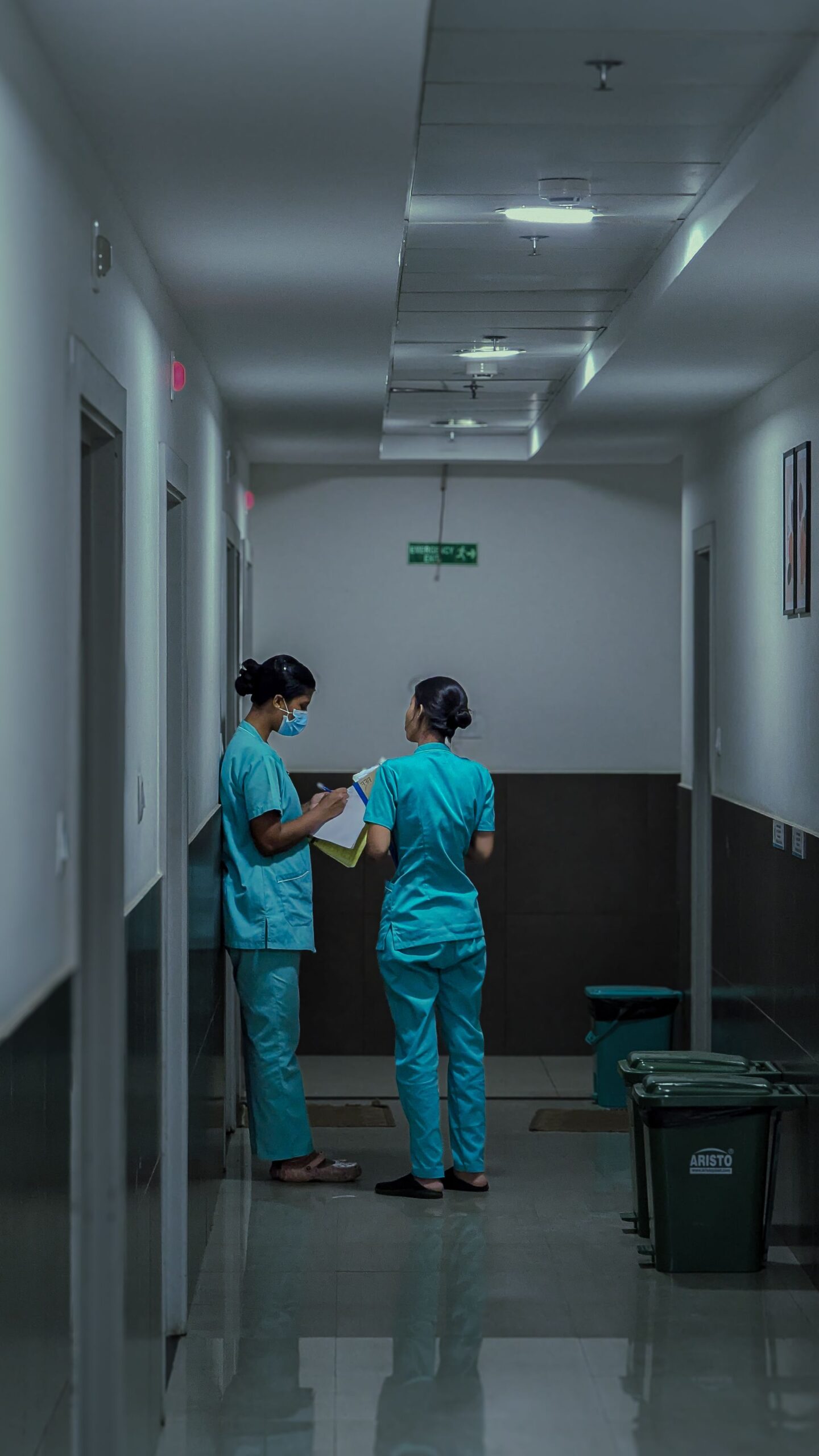 Nurse and colleagues in a German hospital corridor