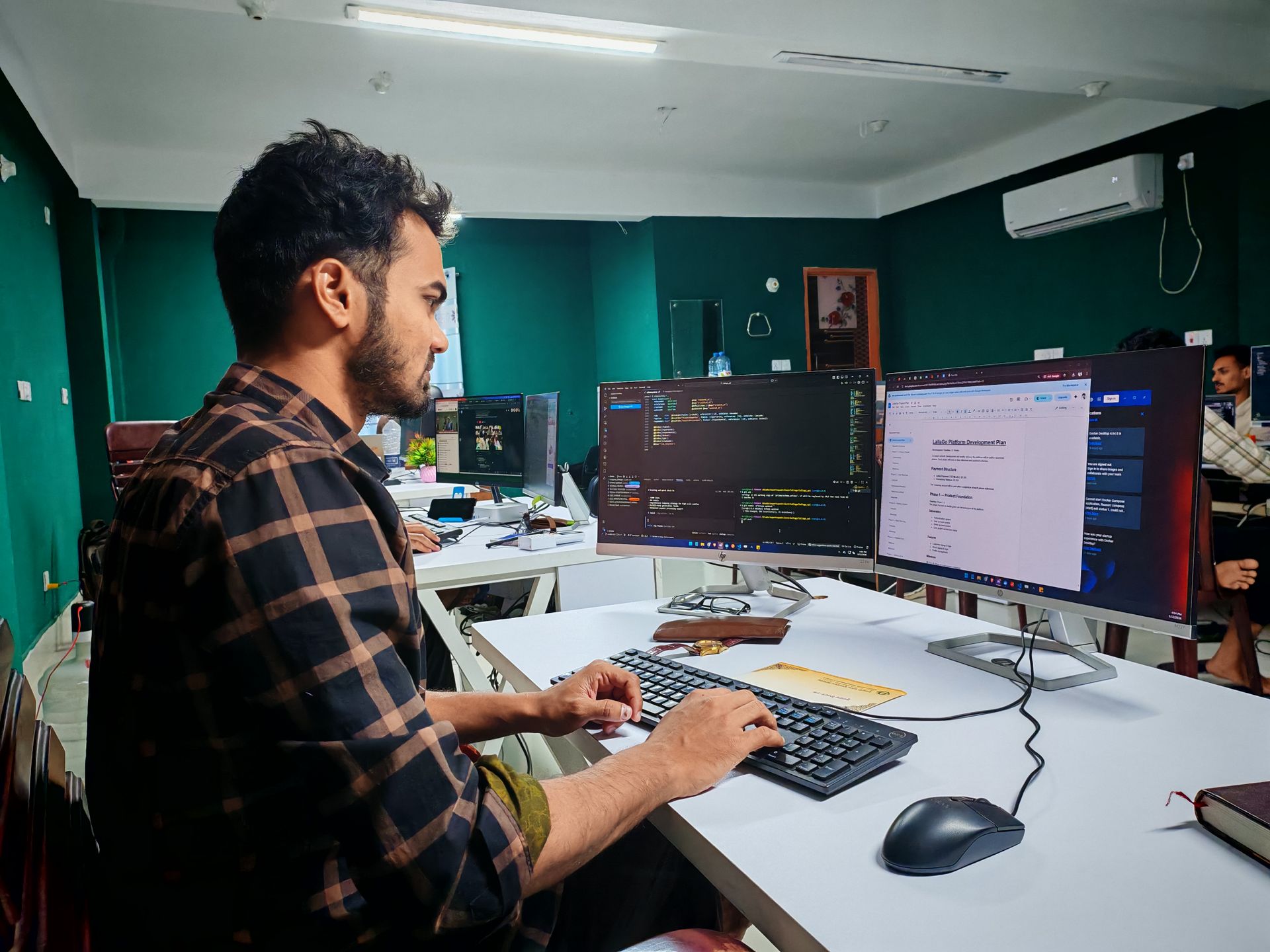Software developer working on code in a Berlin tech office