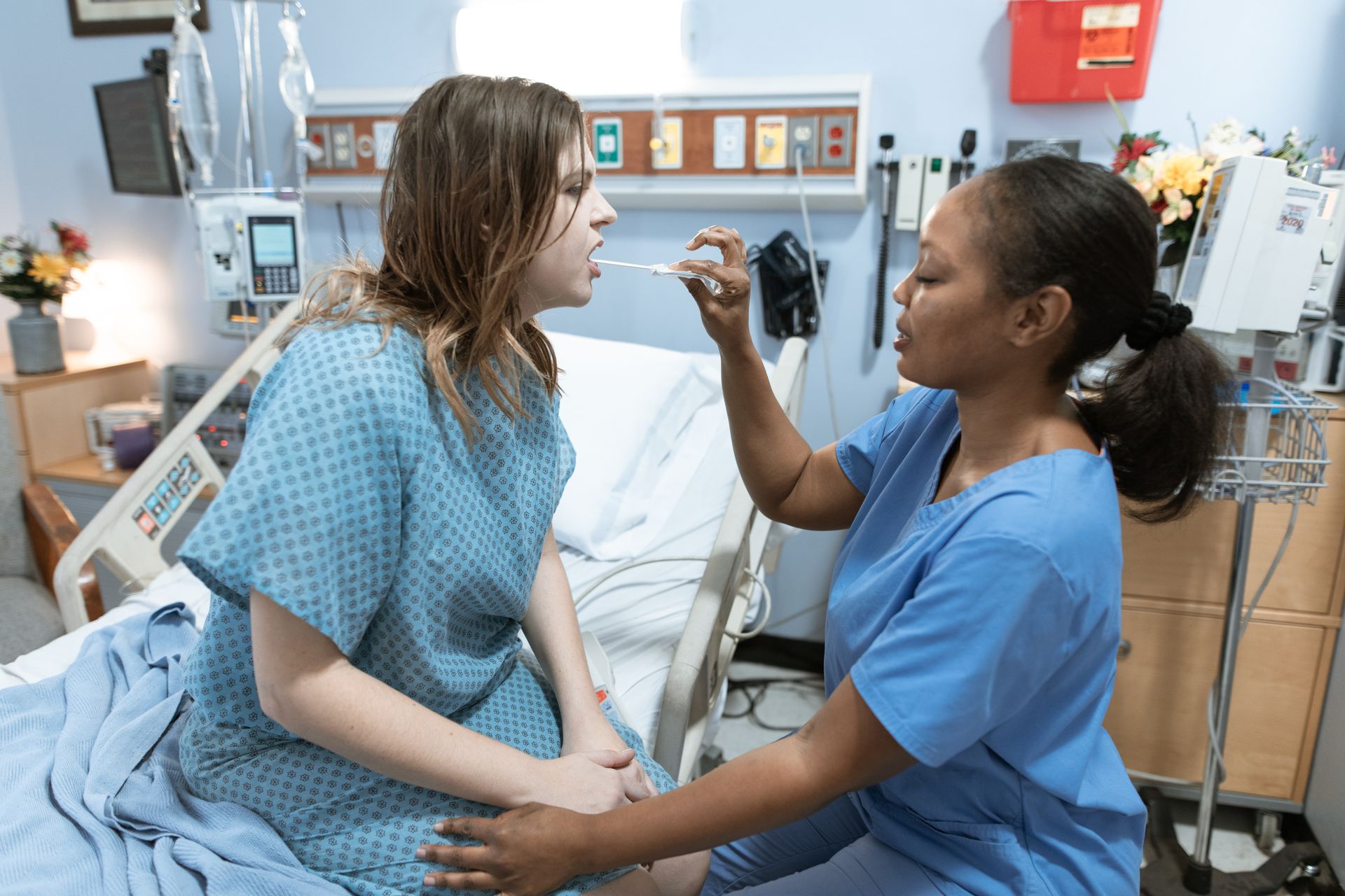 Foreign nurse providing care in a German hospital ward